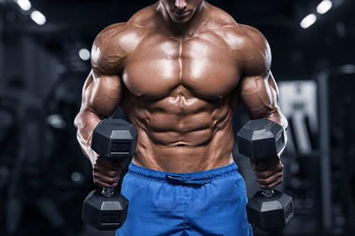 A woman lifting a dumbbell in a gym while her trainer observes, with bold text reading “Finding the Best Gym Near Me with Trainer: A Complete Guide to Fitnes